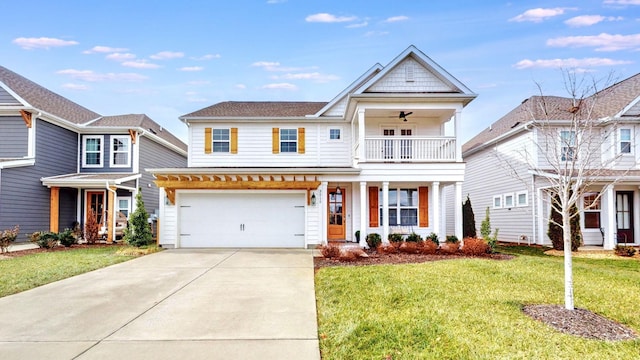 view of front of property with a balcony, a front yard, and a garage