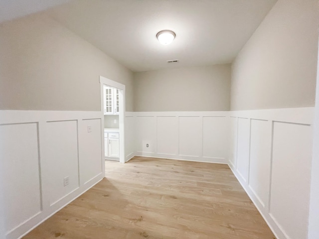 spare room featuring light hardwood / wood-style floors