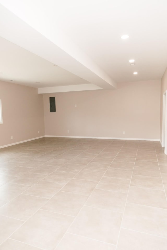 unfurnished room featuring light tile patterned flooring, recessed lighting, and baseboards