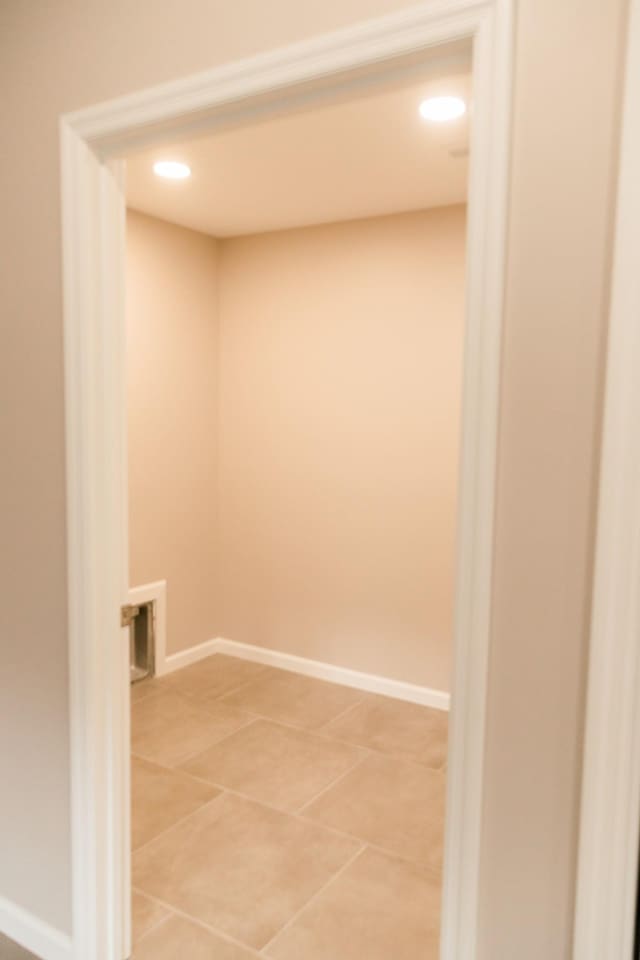 interior space with light tile patterned flooring, recessed lighting, and baseboards