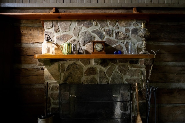 interior details with a stone fireplace