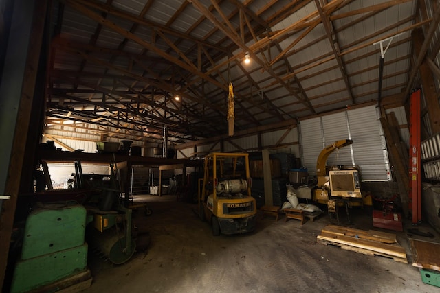 misc room featuring concrete floors and lofted ceiling