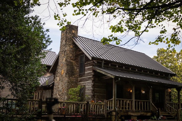 view of side of property featuring a porch