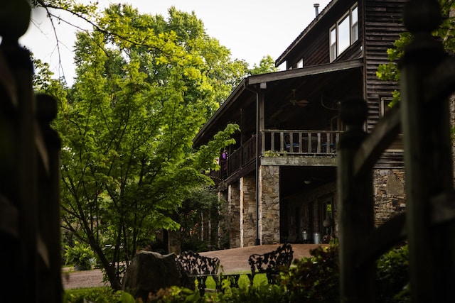 view of side of property featuring a balcony