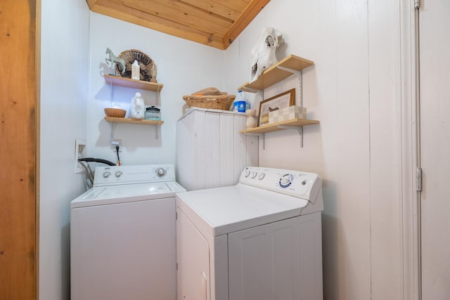 clothes washing area with wood ceiling and washing machine and clothes dryer