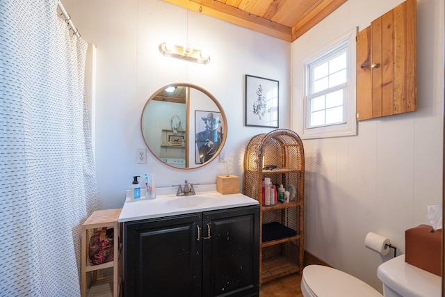 bathroom with vanity, toilet, and a shower with shower curtain