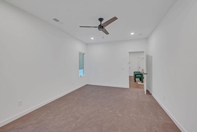 carpeted spare room featuring a ceiling fan, recessed lighting, visible vents, and baseboards