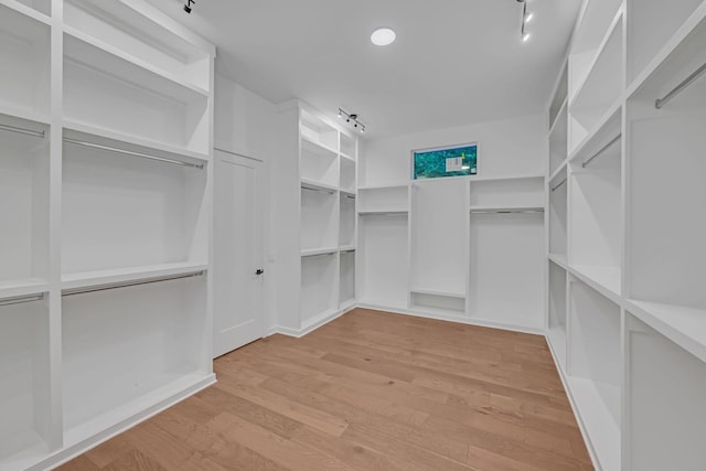 spacious closet with wood finished floors