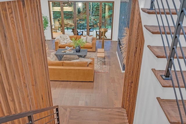 living room featuring stairway and wood finished floors