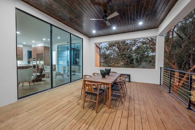 deck with ceiling fan and outdoor dining area