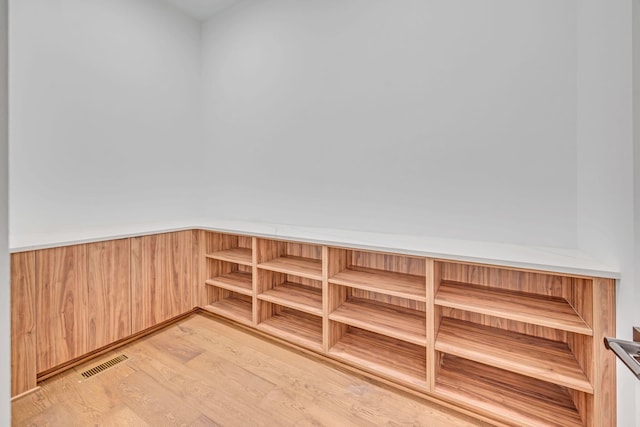 interior space featuring light wood-type flooring and visible vents