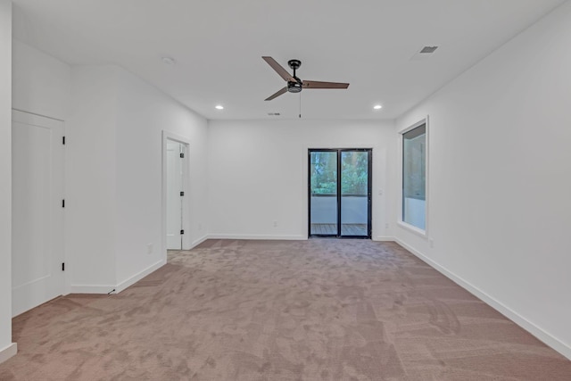 unfurnished room featuring light carpet, baseboards, and recessed lighting