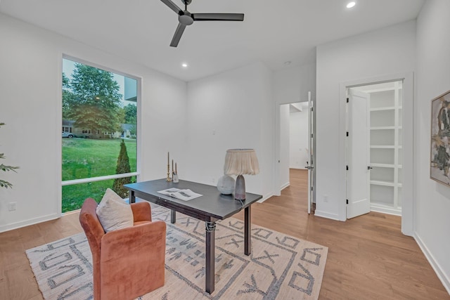 office space with baseboards, light wood finished floors, a ceiling fan, and recessed lighting