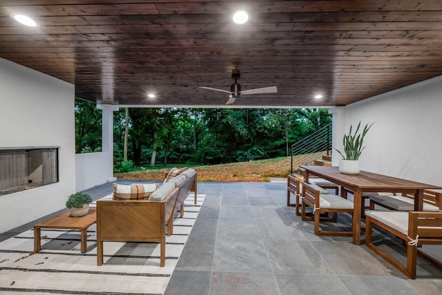 view of patio / terrace with outdoor dining space, outdoor lounge area, and a ceiling fan