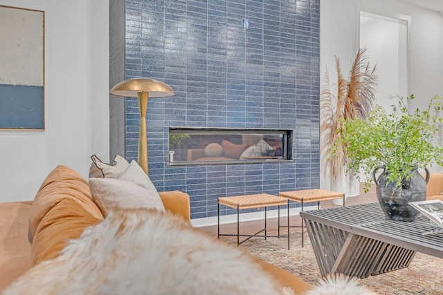 sitting room with a tile fireplace