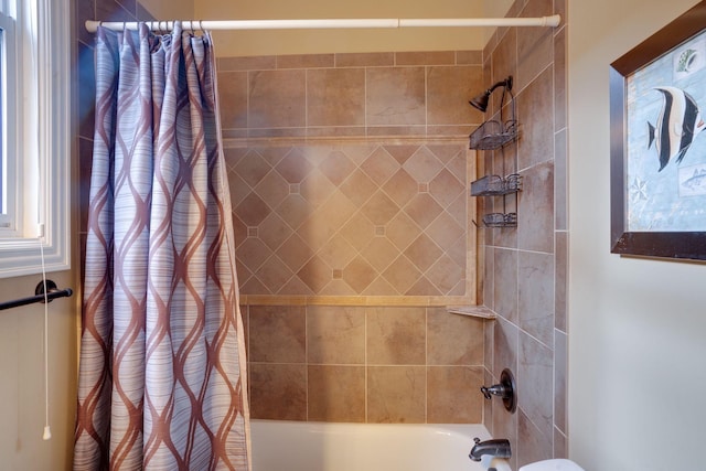 bathroom with shower / tub combo with curtain