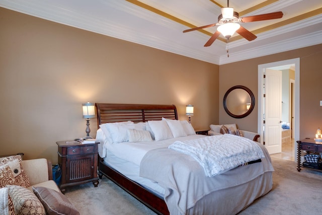 carpeted bedroom with ceiling fan and ornamental molding