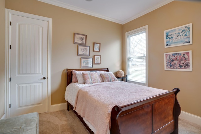 carpeted bedroom with ornamental molding