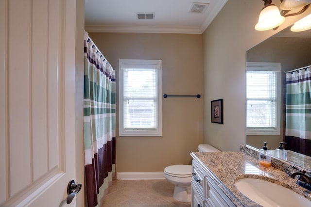 bathroom with a healthy amount of sunlight, crown molding, tile patterned floors, and vanity