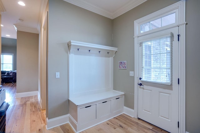 mudroom with light wood-type flooring and ornamental molding