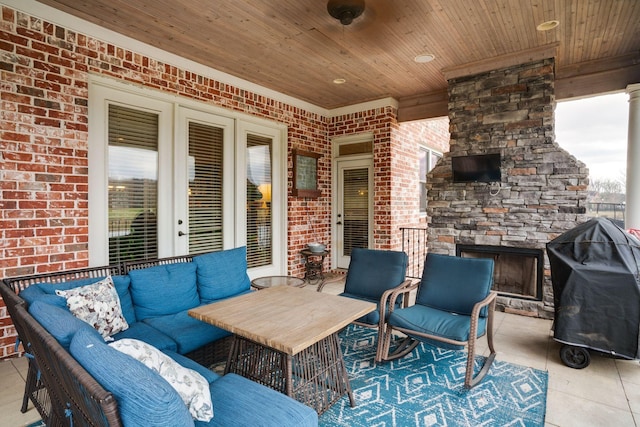 view of patio / terrace featuring an outdoor living space with a fireplace