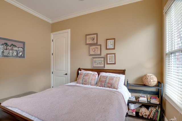 bedroom with ornamental molding