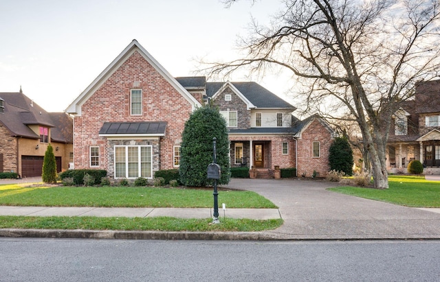 view of front property with a front lawn and a garage