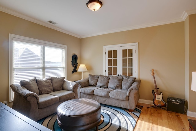 living room featuring ornamental molding and hardwood / wood-style floors