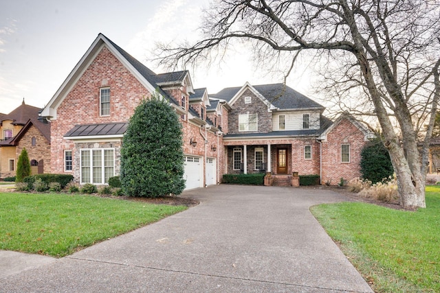 view of property featuring a garage and a front yard