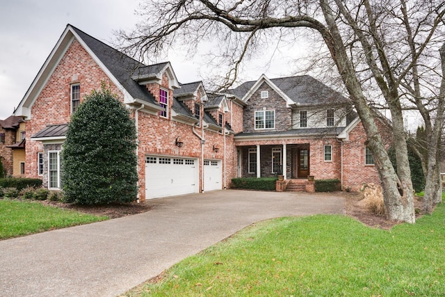 view of front of property featuring a garage and a front yard