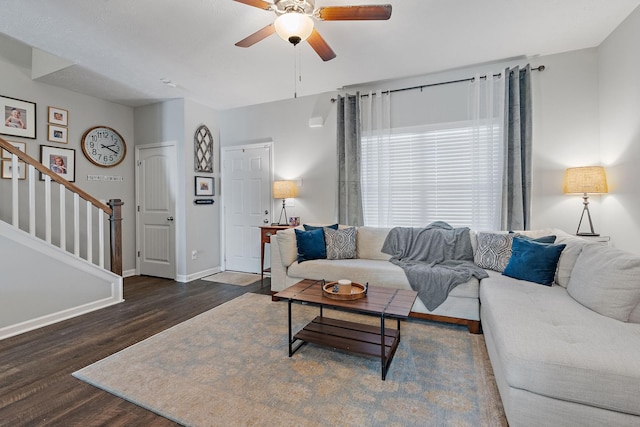 living room with ceiling fan and dark hardwood / wood-style floors