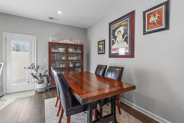 dining space featuring hardwood / wood-style flooring