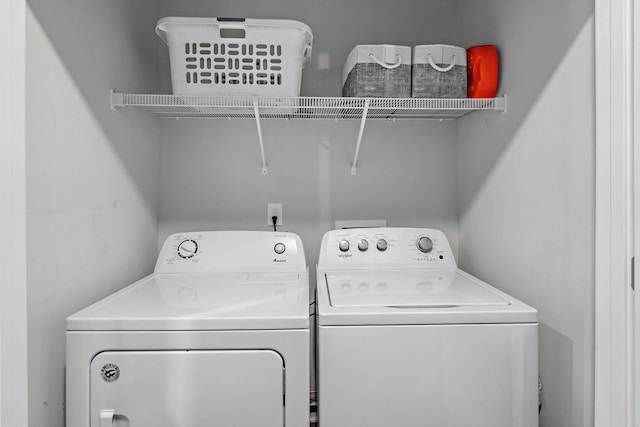 laundry area with washing machine and clothes dryer