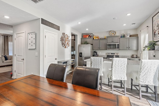 dining room with a textured ceiling