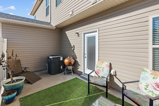 view of patio with central air condition unit and area for grilling