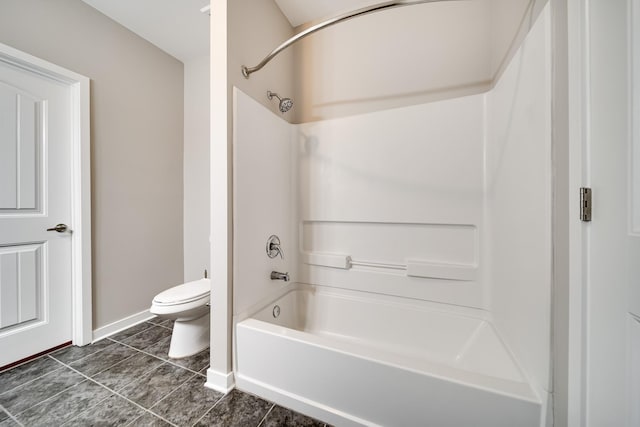 bathroom with toilet, bathing tub / shower combination, and tile patterned flooring