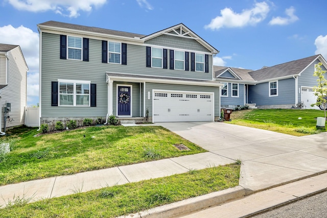 view of front of property with a front yard and a garage