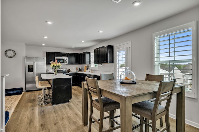 dining space featuring light wood-type flooring