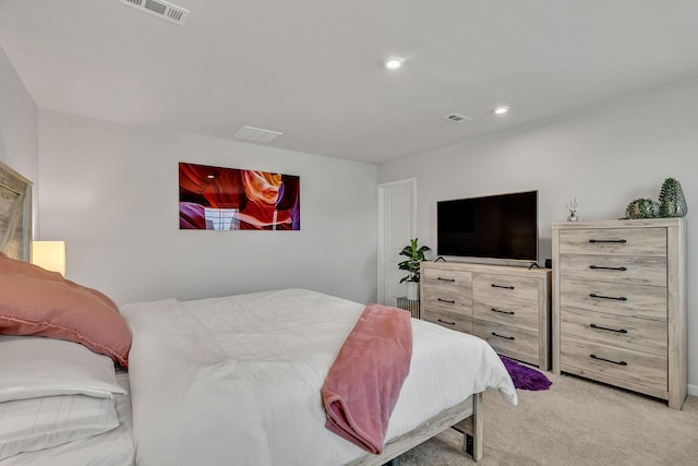 bedroom with light carpet