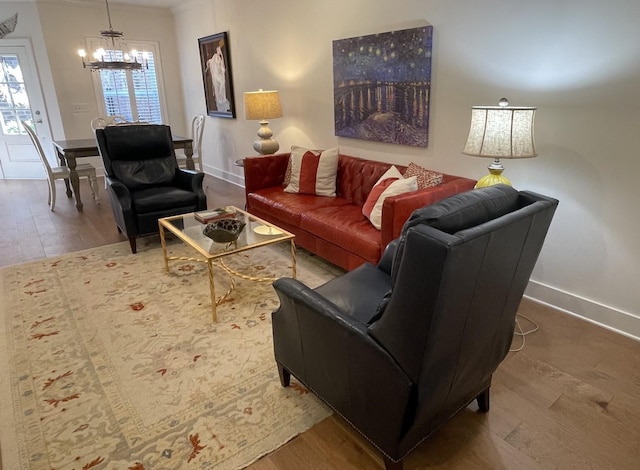 living room with wood-type flooring and a chandelier