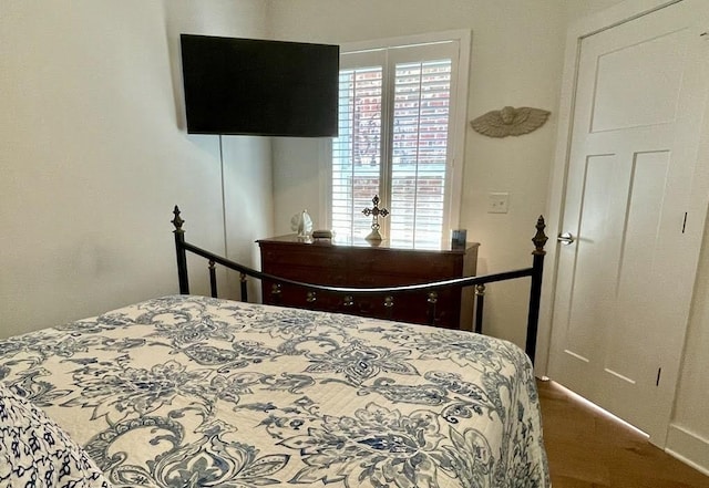 bedroom featuring hardwood / wood-style floors