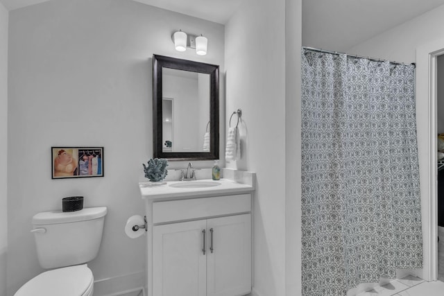 bathroom featuring toilet and vanity