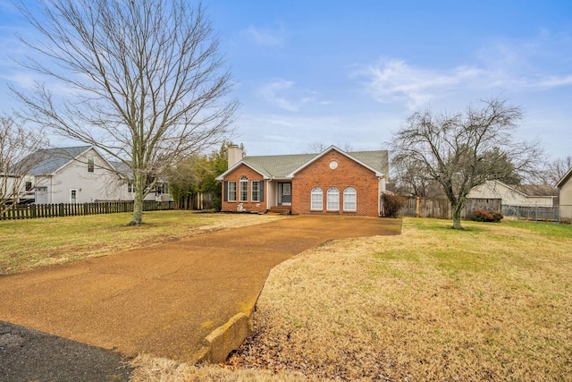 ranch-style home with a front lawn