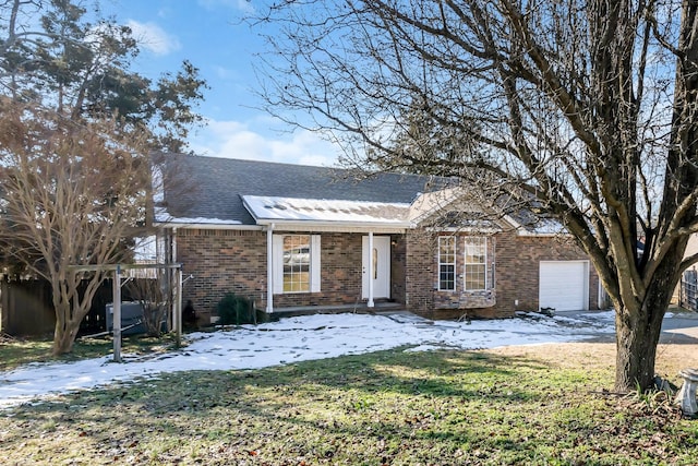 view of front of house with a garage and a lawn