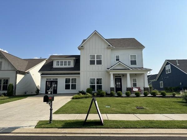 view of front of house with a front lawn and a porch