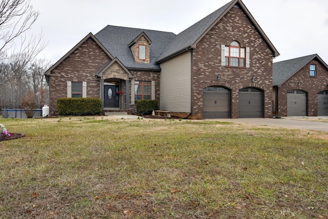 view of front of property featuring a garage and a front yard