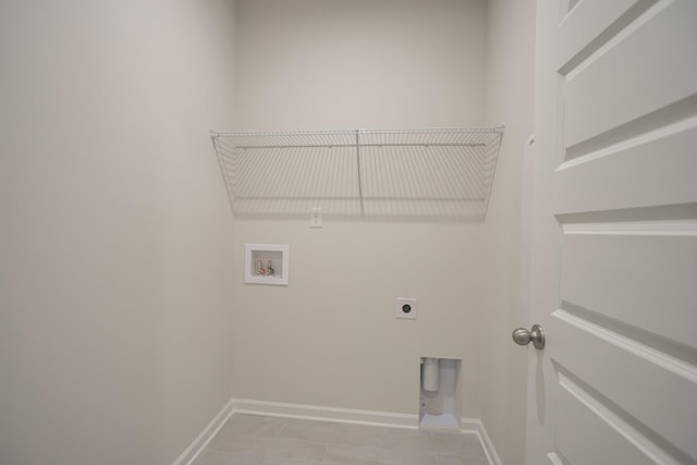 clothes washing area with washer hookup, light tile patterned floors, and electric dryer hookup