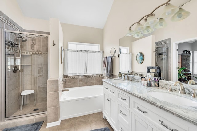 bathroom with lofted ceiling, vanity, separate shower and tub, and tile patterned floors