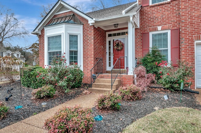 view of exterior entry featuring a garage