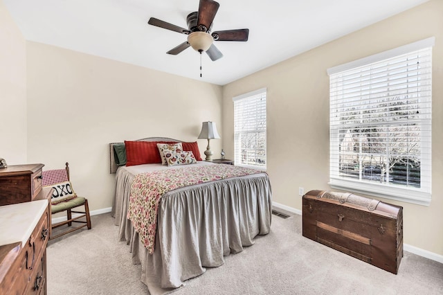 bedroom featuring ceiling fan and light carpet